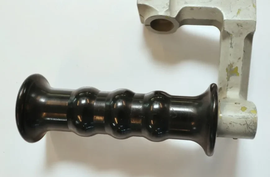 Ceramic and metal heat shields mounted near a turbo in a car exhaust bay