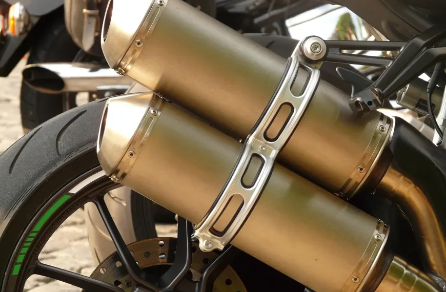 Motorcycle exhaust ceramic coating vs chrome on a parked cruiser in natural sunlight