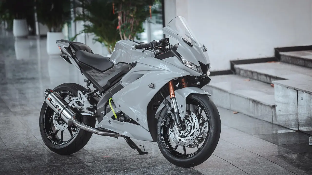 Motorcycle exhaust header vs slip-on differences: the core trade-off